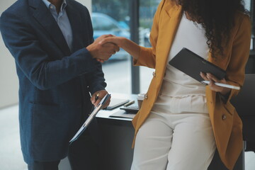 Business handshake for teamwork of business merger and acquisition,successful negotiate,hand shake,two businessman shake hand with partner to celebration partnership and business deal concept