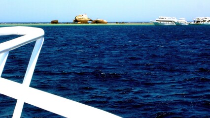Fototapeta premium Remains of a Sunken Sea Transport Vessel Near Coral Island in the Red Sea Sinai Egypt