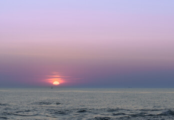Serene sunset at the shoreline in Kolobrzeg, Kołobrzeg