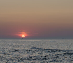 Fototapeta premium Serene sunset at the shoreline in Kolobrzeg, Kołobrzeg
