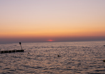 Serene sunset at the shoreline in Kolobrzeg, Kołobrzeg