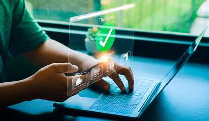 Person Making Online Payment with Credit Card on Laptop, Holographic Interface Showing Payment Successful and Shopping Icons, Representing E-commerce and Digital Transactions