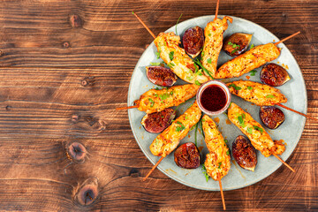 Grilled chicken breast on skewers.