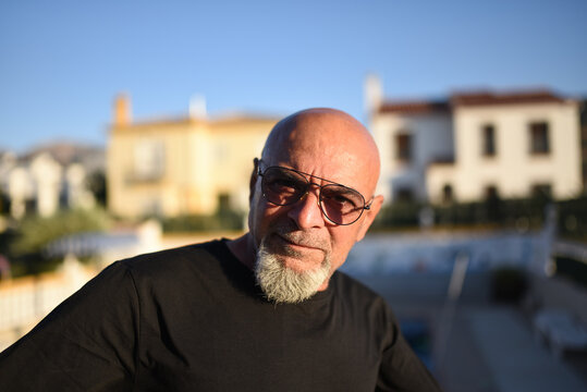 65 years old mature senior man portrait with eyeglasses