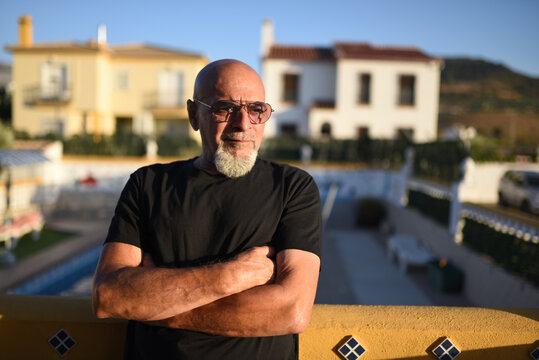 65 years old mature man portrait with goatee and eyeglasses