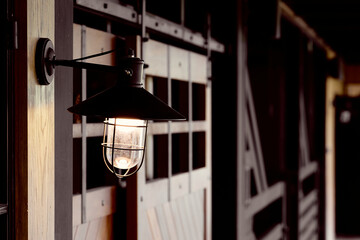 Steel tungsten light bulb in countryside farm