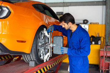 Auto Car wheel centering calibration machine. Car maintenance and auto service garage concept