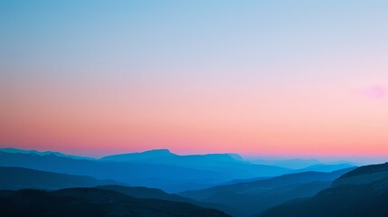 A scenic view of mountains at sunset.