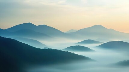 Fototapeta premium Peaceful mountain landscape at dawn with mist covering the rolling hills and a serene sky, creating a tranquil and calming scene.