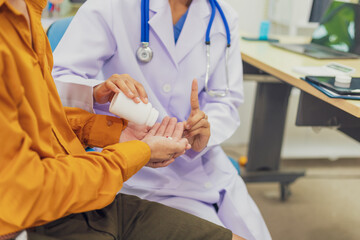 A female doctor performs a check for an enlarged prostate, evaluating male health issues such as...