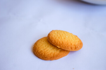 Danish butter cookies, stack of golden chocolate butter cookies isolated on white background, sweet pastry