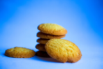 Danish butter cookies, stack of golden chocolate butter cookies isolated on white background, sweet pastry
