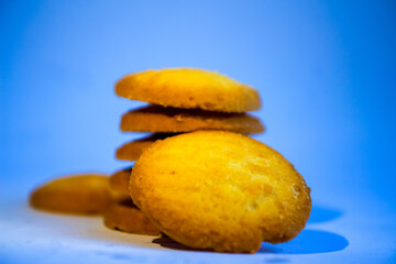 Danish butter cookies, stack of golden chocolate butter cookies isolated on white background, sweet pastry