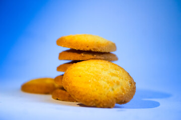 Danish butter cookies, stack of golden chocolate butter cookies isolated on white background, sweet pastry