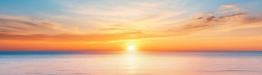 Fototapeta premium Golden sunset over a calm sea, clear weather, warm glow on the horizon