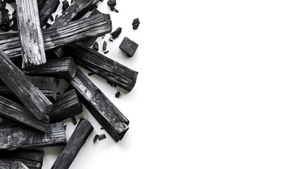 Natural wooden charcoal isolated on white background with full depth of field. Top view with copy space for your text