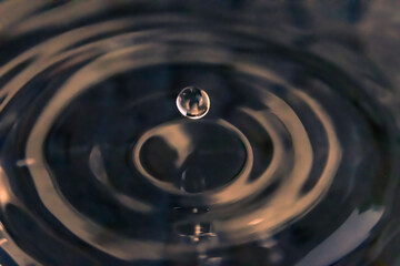The Imminent Descent of a Single Droplet, Unleashing Waves of Infinite Possibility.