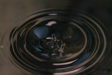 A Droplet Suspended in Time, Sending Ripples Across the Universe's Quiet Surface.