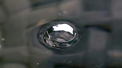 A Droplet Suspended in Time, Sending Ripples Across the Universe's Quiet Surface.