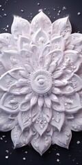 A close-up of a detailed, intricate white flower with a central sunburst design, surrounded by smaller white flowers and scattered white specks against a dark background.