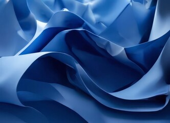 a close-up view of a blue fabric with a textured, flowing appearance, creating a sense of movement and depth.