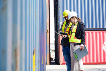 Engineers inspecting containers, container shipping systems.