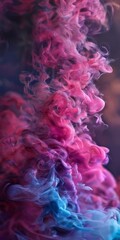 Obraz premium close-up view of a swirling, abstract pattern of pink and blue smoke or vapor against a dark background.