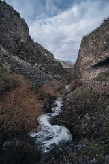 gorge with river of basalt columns, mountains in Armenia, symphony of stones