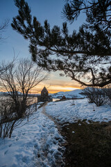 church on lake sevan at sunset in armenia