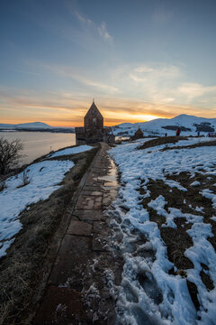 church on lake sevan at sunset in armenia