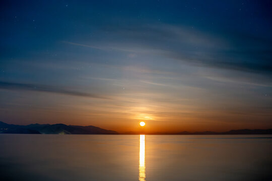 moonrise over mountain lake at night, Sevan in Armenia
