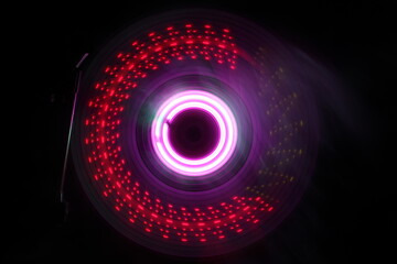 Music Dj concept. Trail of fire and smoke on vinyl record. Burning vinyl disk. Turntable vinyl record play Selective focus