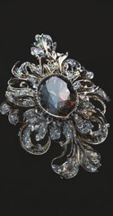 Fototapeta premium a close-up of a decorative brooch or pendant with a large central gem surrounded by smaller gemstones and intricate metalwork.