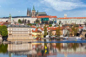 View of Charles bridge over Vltava river and Gradchany (Prague Castle) and St. Vitus Cathedral