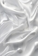 Obraz premium close-up view of a white, wavy substance, possibly a cream or lotion, with a soft, blurred texture.