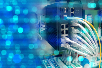 Industrial network equipment. Fiber optic internet cables. Network switches back view....