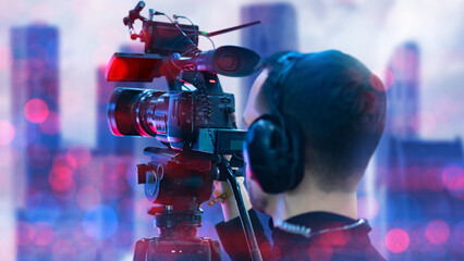 Man video operator. Filming camera. Guy shooting video. Videography specialist. Work of videographer. Shooting with professional camera with tripod. Man shoots on professional video camera