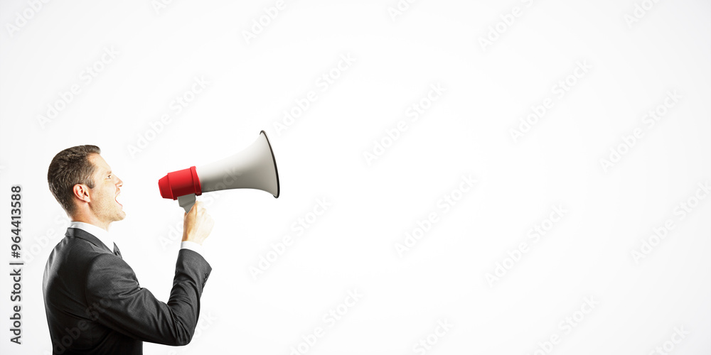 Poster businessman in a suit shouting into a megaphone on a white background, symbolizing communication and