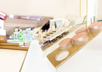 buying make up at cosmetics section in store. choosing cosmetics, perfumes, creams and shampoos