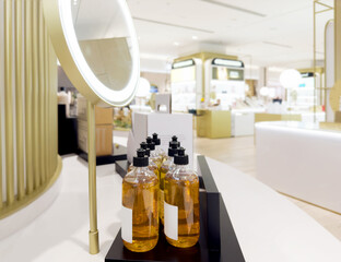 buying make up at cosmetics section in store. choosing cosmetics, perfumes, creams