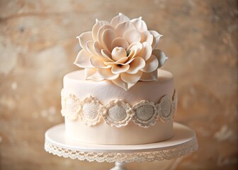 • Pale pink cake topper adorned with fragile, paper-thin petals that resemble antique lace, set against a soft, creamy backdrop that evokes a sense of nostalgia.