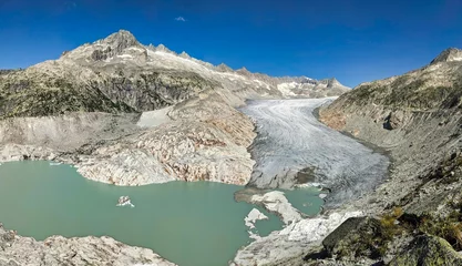 Fotobehang Gletsjer Panoramic image of the Rhone Glacier in summer 2024. Melting glaciers due to climate. Big Rhonegletscher picture in Switzerland. High quality photo  © SimonMichael