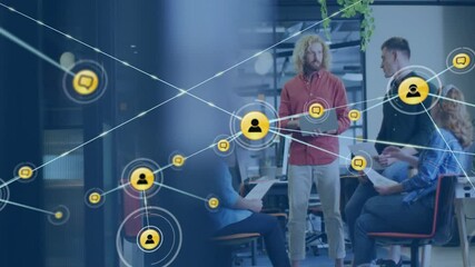 Animation of network of connections with people icons over diverse business people in office