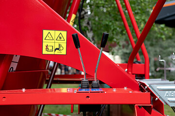 Blue hydraulic equipment close up. Levers for operating hydraulic equipment. Fragment of a blue...