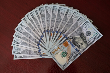 estate agent with customer after contract signature of buying house, Sign contract for more money, US Dollar banknotes money on printed contract paper and pen to sign