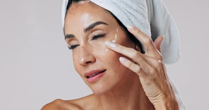 Moisturizer, woman and skincare for anti aging, cosmetics and glow, dermatology and white background. Mature person, healthy skin and product in cosmetology with beauty, confidence or pride for face