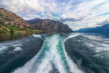 Boats wake on Lake Garda, Italy