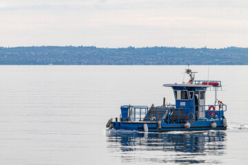 Rubbish cleaner ship on the Garda Lake