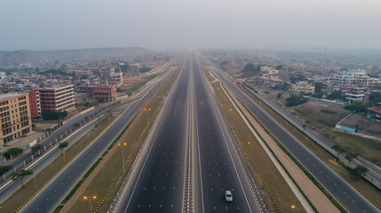 A stunning aerial view of a newly constructed express highway in India showcases modern infrastructure with heavy toll charges imposed.