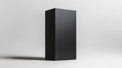 A sleek, black rectangular carton box standing vertically, with clean lines and a shadow on a blank background